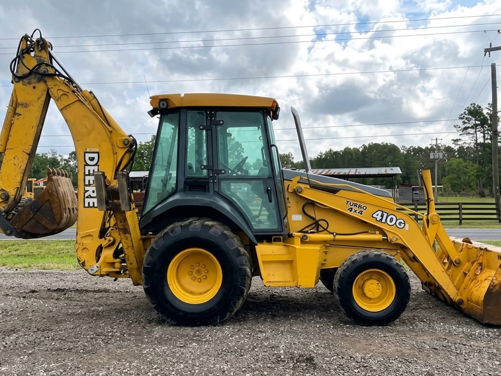 2004 JOHN DEERE 410G — photo 1