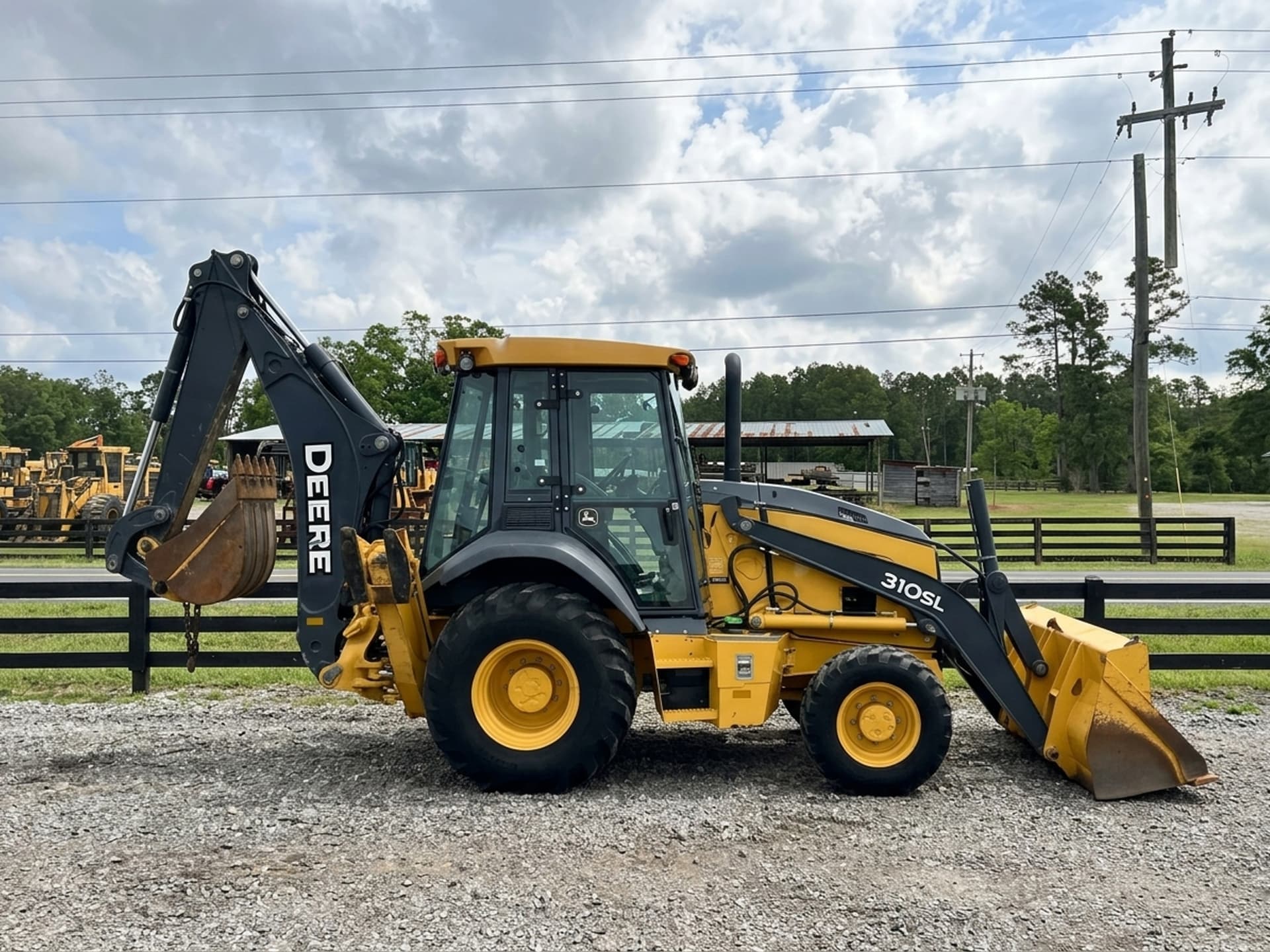 2015 JOHN DEERE 310SL — photo 1